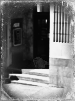 homeless man in doorway